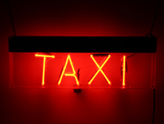taxi neon sign in red for hire