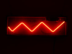 red neon zigzag sign